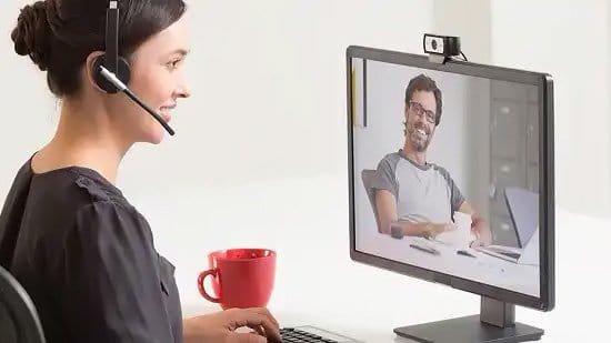 Woman using web camera for video call